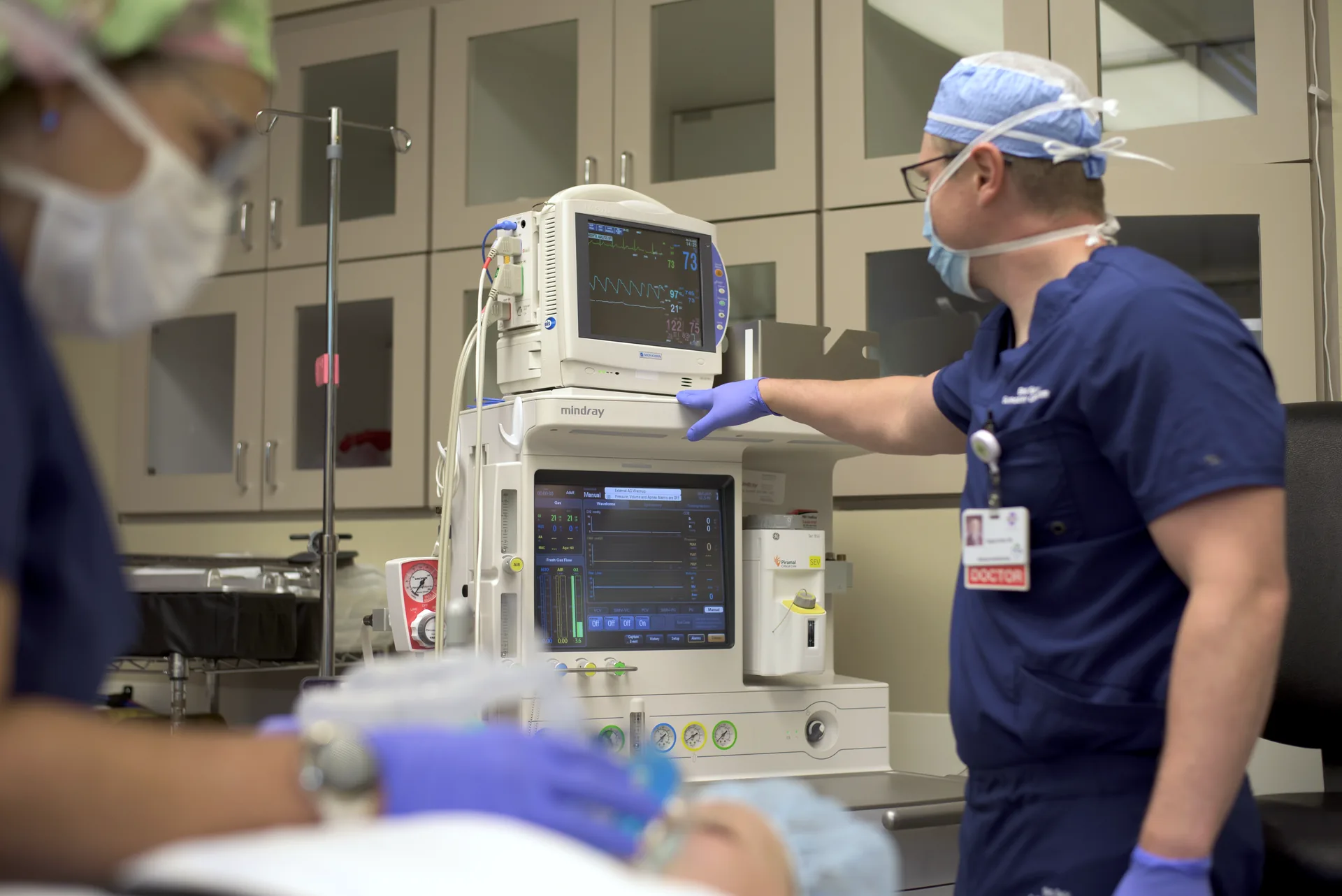 Anesthesiologists monitoring a patient during surgery