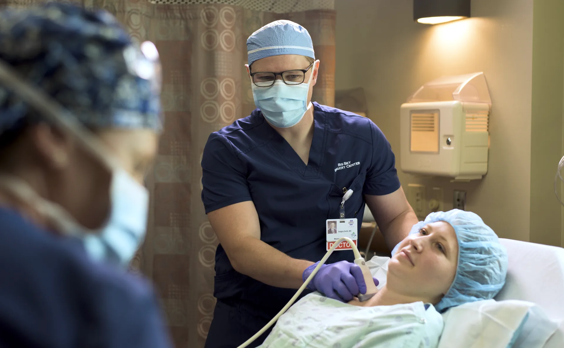 Anesthesiologist with patient