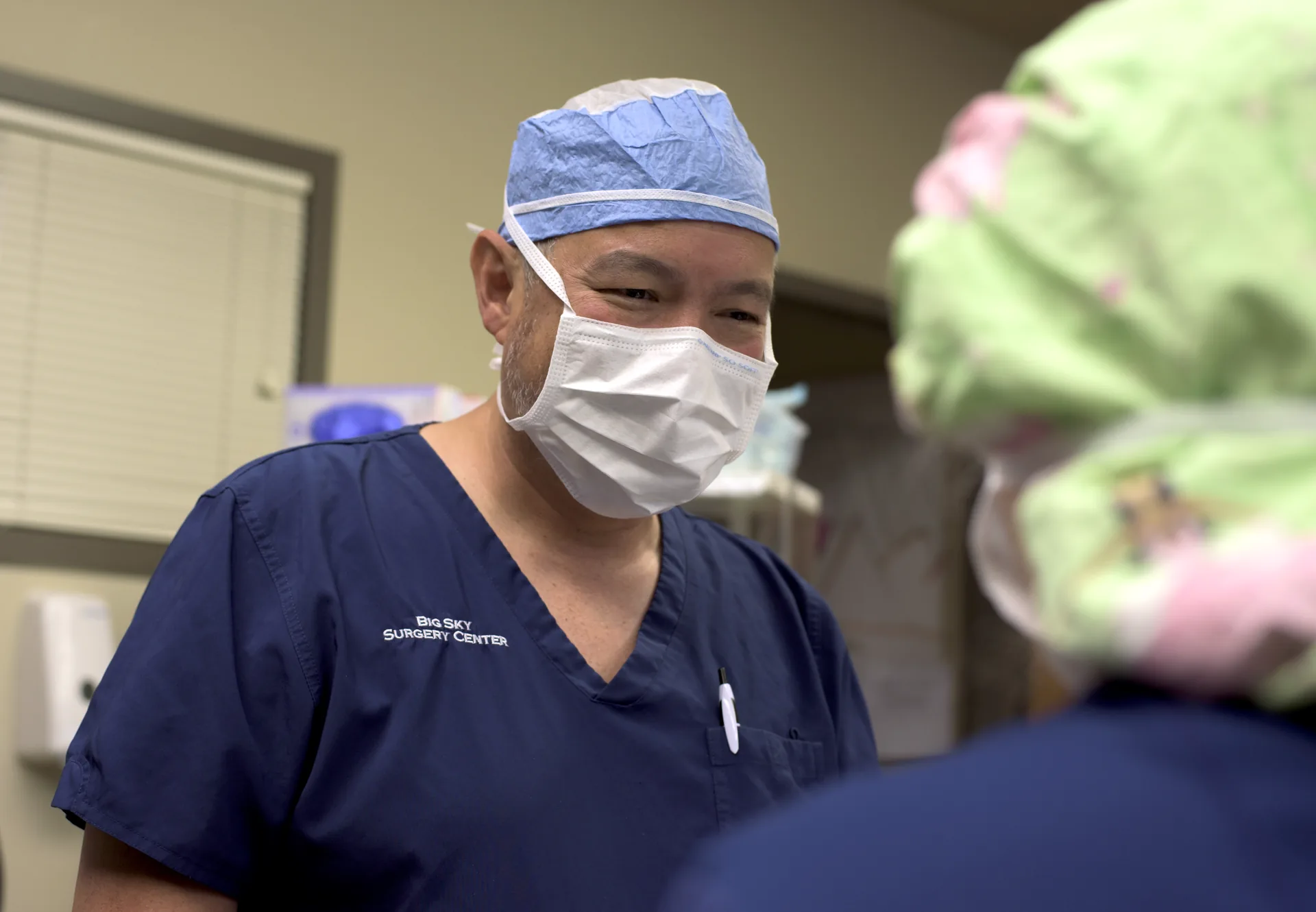 Anesthesiologist preparing equipment